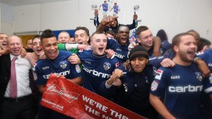 The Oldham players celebrate after defeating Liverpool 3-2 in the FA Cup fourth round